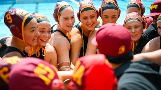 USC players and coaches huddle up at Uytengsu Aquatics Center.