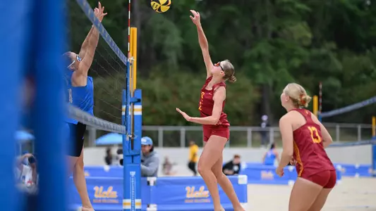 USC beach volleyball junior Delaney Karl attacks the ball during a match against No. 1-ranked UCLA at Mapes Beach.