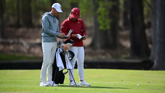 Catherine Park and Justin Silverstein Study the upcoming hole at Big Ten Championships