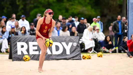 USC beach volleyball junior Madison White gets ready to serve a ball in a dual against UCLA at Mapes Beach in Westwood, Calif.