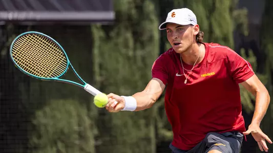 Nathan Trouve hits ball against Michigan at David X. Marks Tennis Stadium