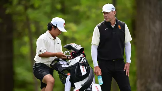 Jaden Dumdumaya and coach Mark Hankins at the Big Ten Championships