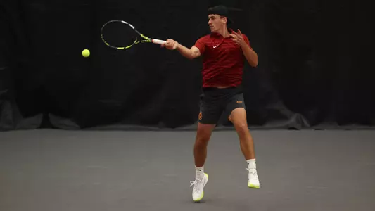Senior Peter Makk returns a shot at the Big Ten Tournament against Michigan State