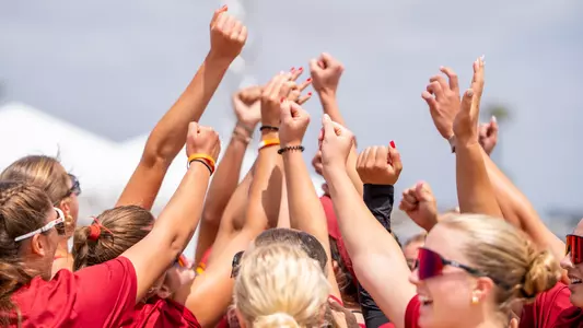 The USC beach volleyball team gathers for a huddle during the MPSF championship in Huntington Beach, California