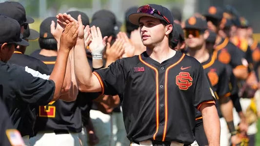 Jack Basseer high fives teammates after a win over Nebraska at Great Park in Irvine.