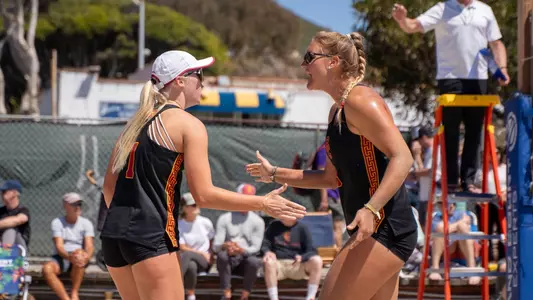 USC beach volleyball sophomore Ashley Pater and freshman Kennedy Coakley celebrate a point during a match at the Best in the West event in Laguna Beach, Calif.