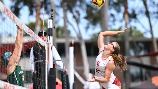 USC beach volleyball sophomore Zoey Henson goes up to attack a ball in a match at Merle Norman Stadium.
