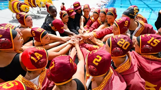 USC women's water polo team huddles up for a cheer before a game vs. Stanford at Uytengsu Aquatics Center