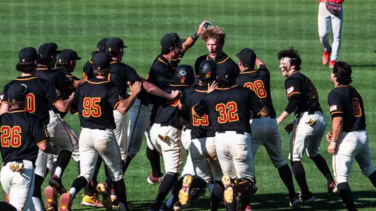 The Trojans celebrate after a walk-off win.