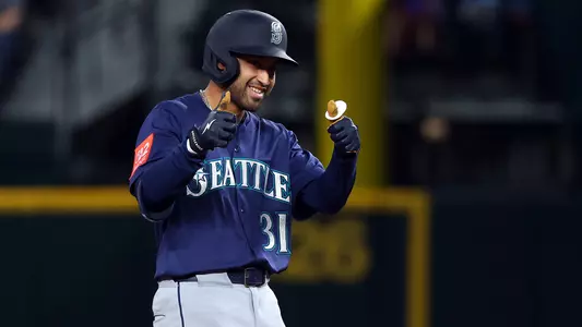 Rhylan Thomas gives a thumbs up during his MLB debut with the Mariners.