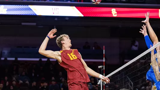 USC men's volleyball middle blocker Wesley Smith goes up to attack a quick set during a match against UCLA at Galen Center.