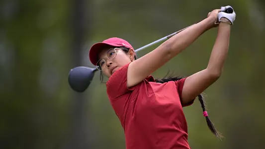 Cindy Kou hits the ball off the tee box at the Big Ten Championships