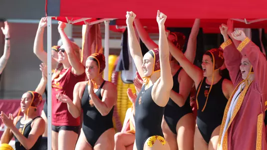 USC bench cheers during a game at Uytengsu Aquatics Center
