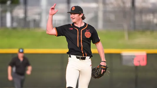 Ethan Hedges celebrates on the mound after a win.