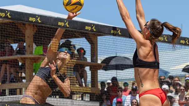 USC beach volleyball alumna Geena Urango attacks the ball during a match at the 2025 AVP Denver Open