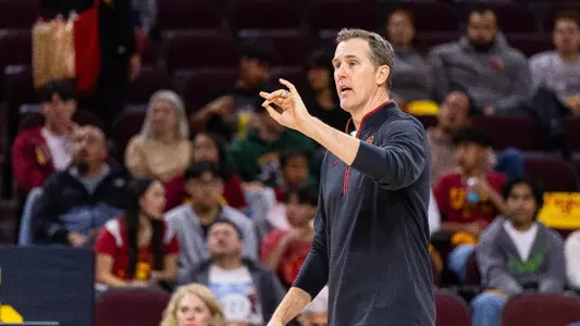 USC men's volleyball head coach Jeff Nygaard coaches from the sideline at Galen Center