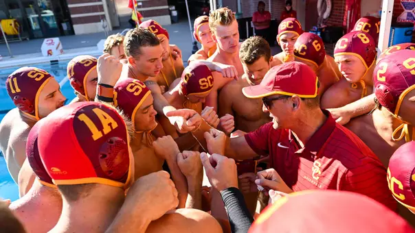 Head coach Marko Pintaric and the USC team huddle up before their 2025 home opener.