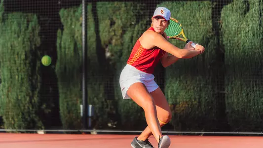 Emma Charney hits a return on court
