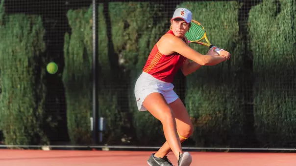 Emma Charney hits a return on court