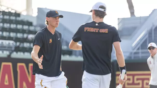 Nathan Trouve high fives a player during play
