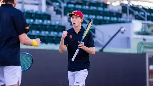 Andrin Casanova celebrates during doubles vs. UCSD
