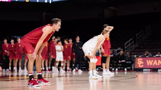 USC men's volleyball outside hitter Dillon Klein and libero Johnny Dykstra await the serve during a match at Galen Center