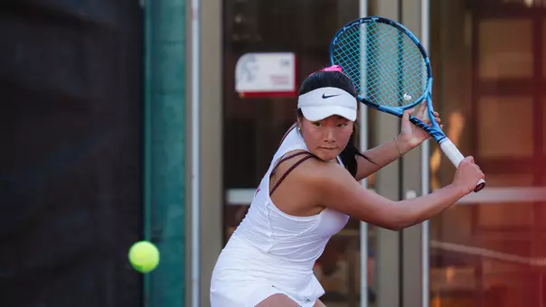 Simone Kay hits a backhand shot