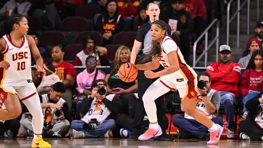 Kara Dunn dribbles a basketball down court during game