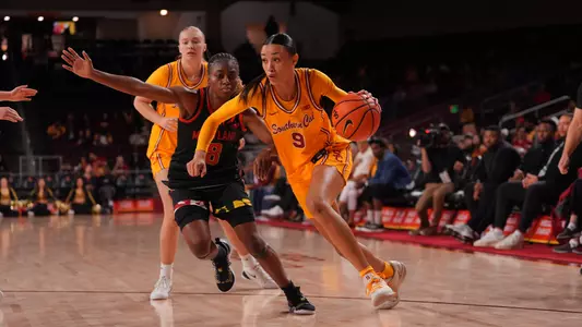 Jazzy Davidson drives to the basket in front of a Maryland defender