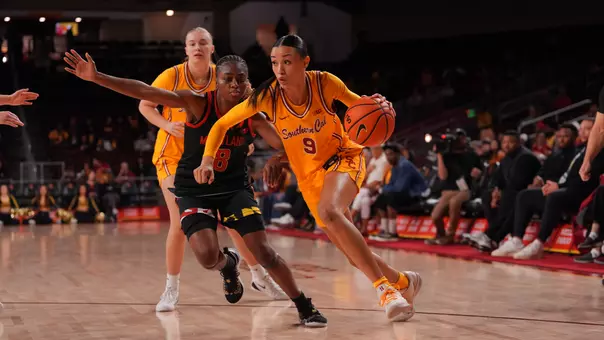 Jazzy Davidson drives to the basket in front of a Maryland defender
