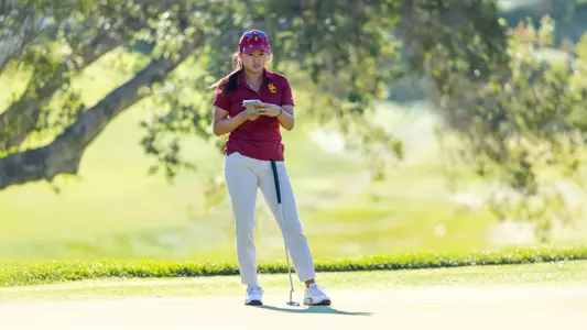 Elise Lee surveys the green at the Stanford Intercollegiate