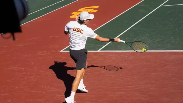 Nathan Trouve hits a tennis ball