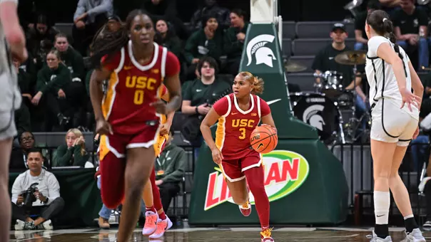 Londynn Jones brings the basketball down the court after inbounding the ball.