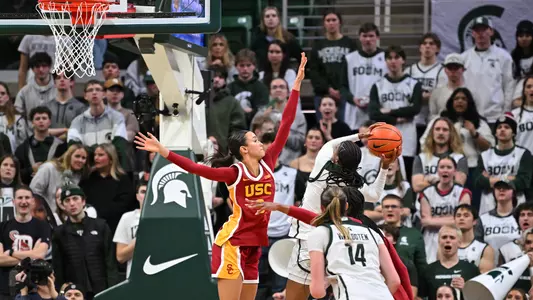 Jazzy Davidson puts her hand up on court to block a basket.