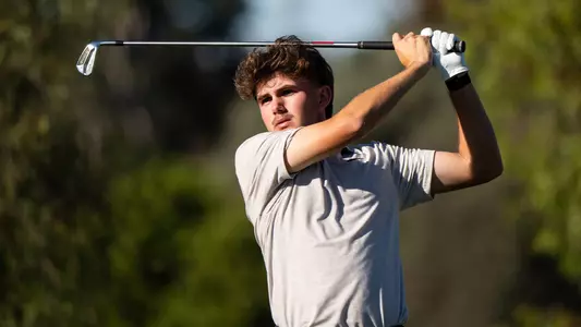 Jack Buchanan swings an iron at the 2026 Copper Cup