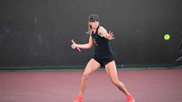 Immi Haddad hits a forehand on the tennis court