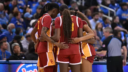 USC women's basketbal huddles as a team after ucla