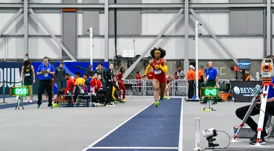 Avery Lewis competing in long jump