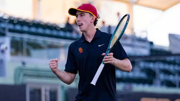 Andrin Casanova celebrates with a tennis racket