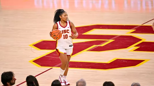 Malia Samuels dribbles the ball down the court.