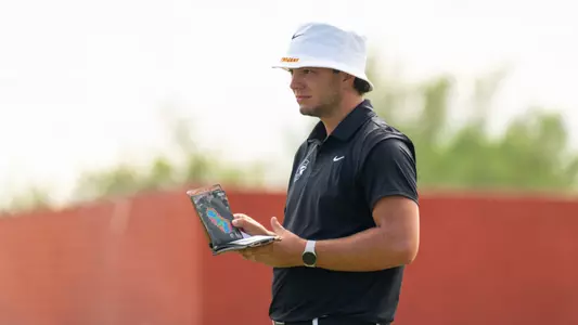 Deitrek Gill checks his notebook at the Bombs Darts Birds Collegiate