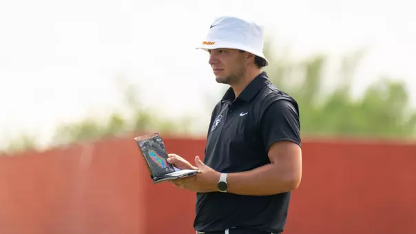 Deitrek Gill checks his notebook at the Bombs Darts Birds Collegiate