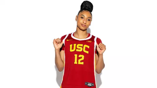 JuJu Watkins tugs on jersey during photoshoot.