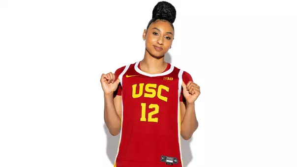 JuJu Watkins tugs on jersey during photoshoot.