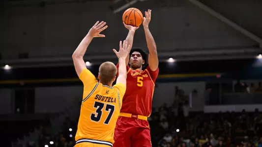 Jacob Cofie shoots over a UC San Diego defender