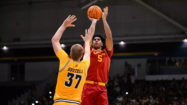 Jacob Cofie shoots over a UC San Diego defender