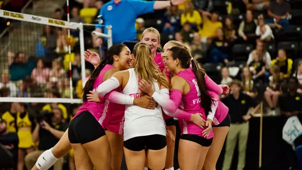 USC women's volleyball players huddle after a point during a match against Iowa at Xtream arena in Coralville, Iowa