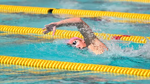 Swimmer competes in pool