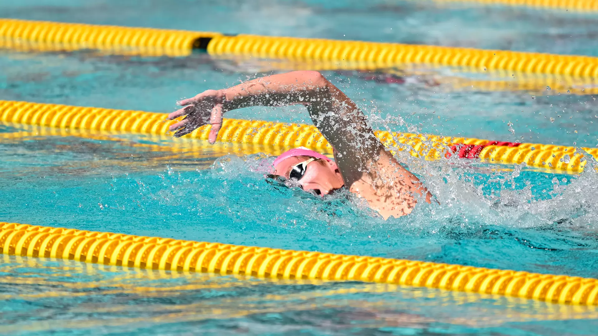 Swimmer competes in pool