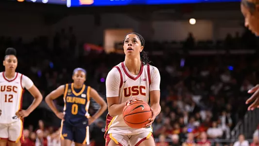 Saniyah Hall shooting on court.